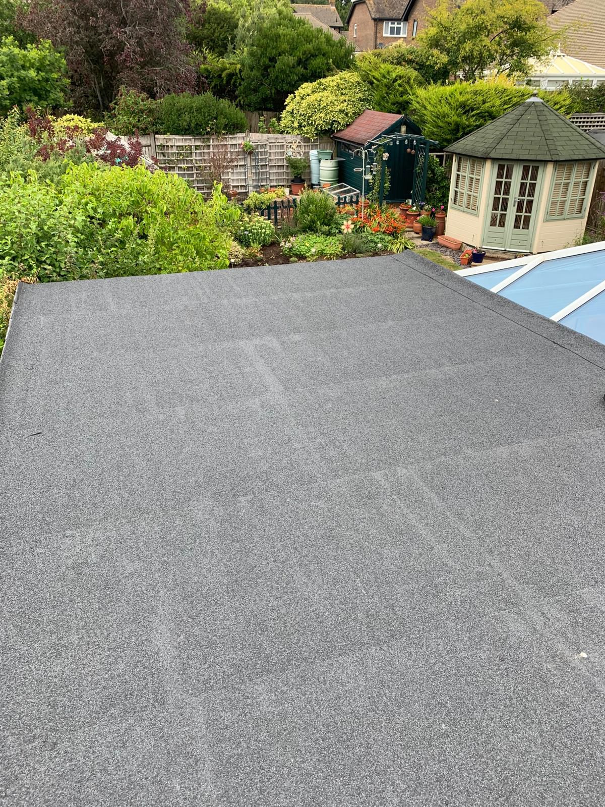 New roofing felt applied to flat roof New roofing felt applied to flat roof
