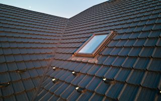 Roof window on a tiled roof